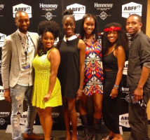 Allison Edwards-Crewe in a dress posing in the middle a group of six at an American Black Film Festival (ABFF) awards event